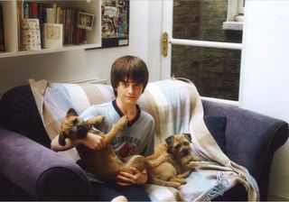 Daniel Radcliffe aged 13 with two dogs at his family home