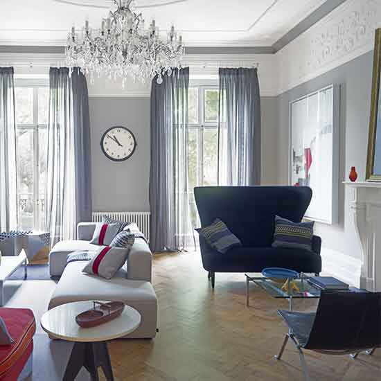 living room with chandelier and curtains on window