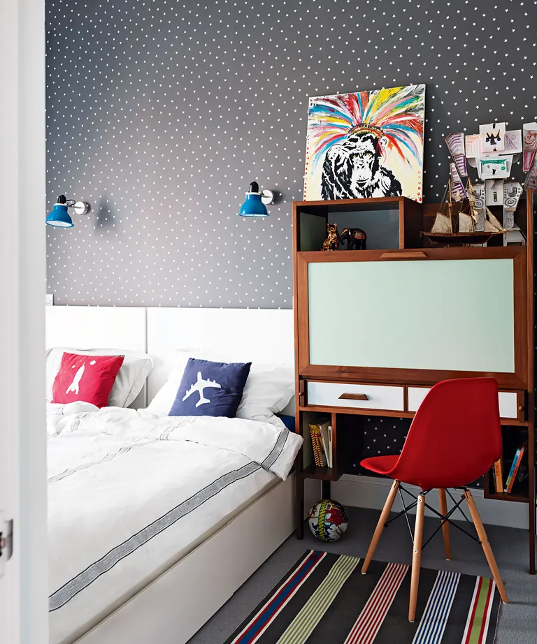 Kids bedroom with grey wallpaper and storage desks