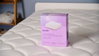 Purple Waterproof Mattress Protector on the bed in the TG Sleep Studio