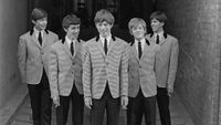 UNITED KINGDOM - circa 1963: English rock and roll group The Rolling Stones posed wearing matching houndstooth check jackets and dark grey trousers circa 1963. From left to right; Charlie Watts, Bill Wyman, Mick Jagger, Brian Jones (1942-1969) and Keith Richards. (Photo by Mark Hayward Archive/Redferns)