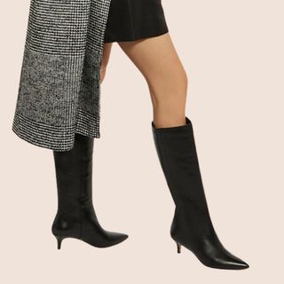 flat lay image of knee high black heel boots