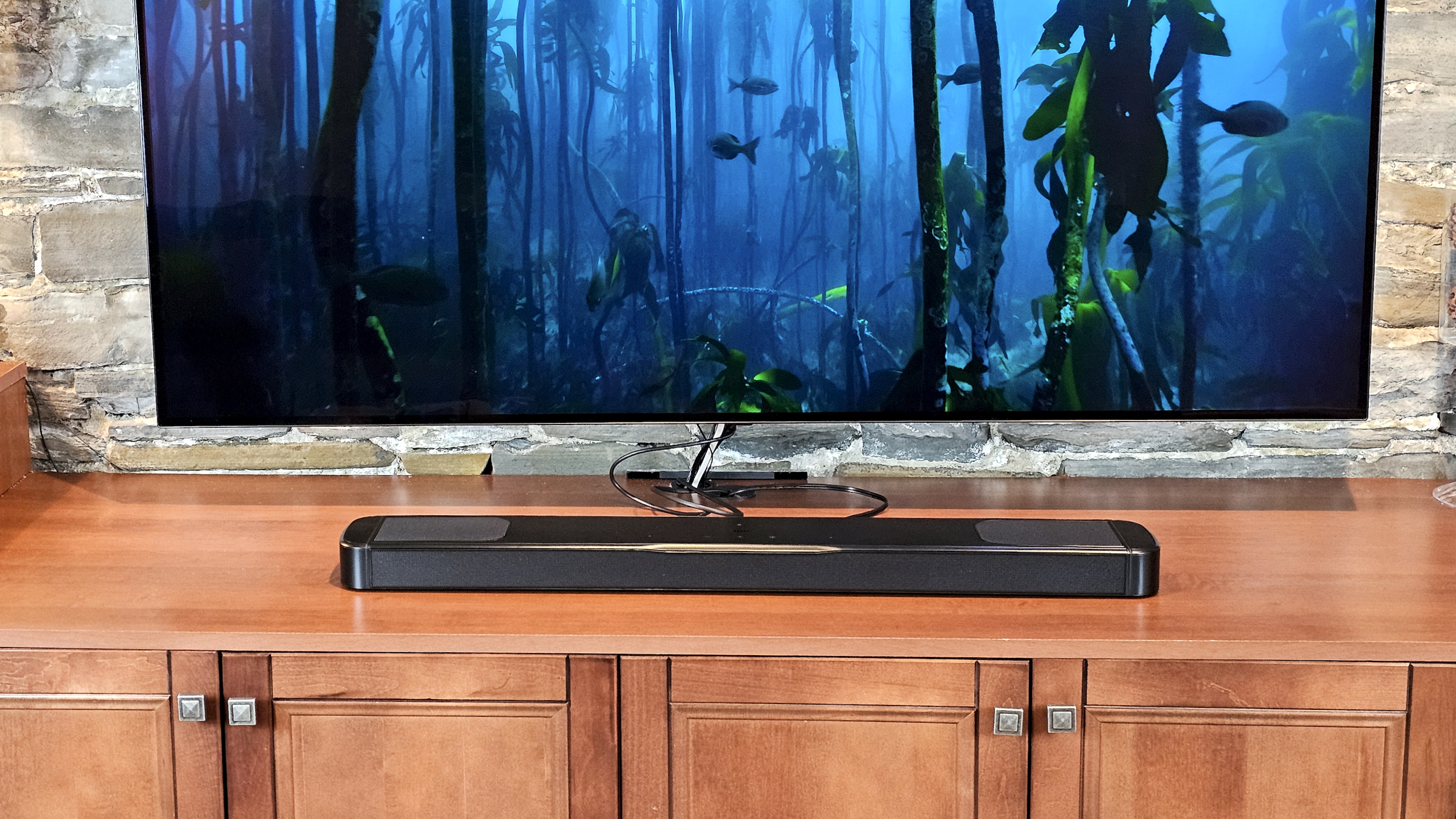 JBL Bar 1000MK2 on TV stand with TV 