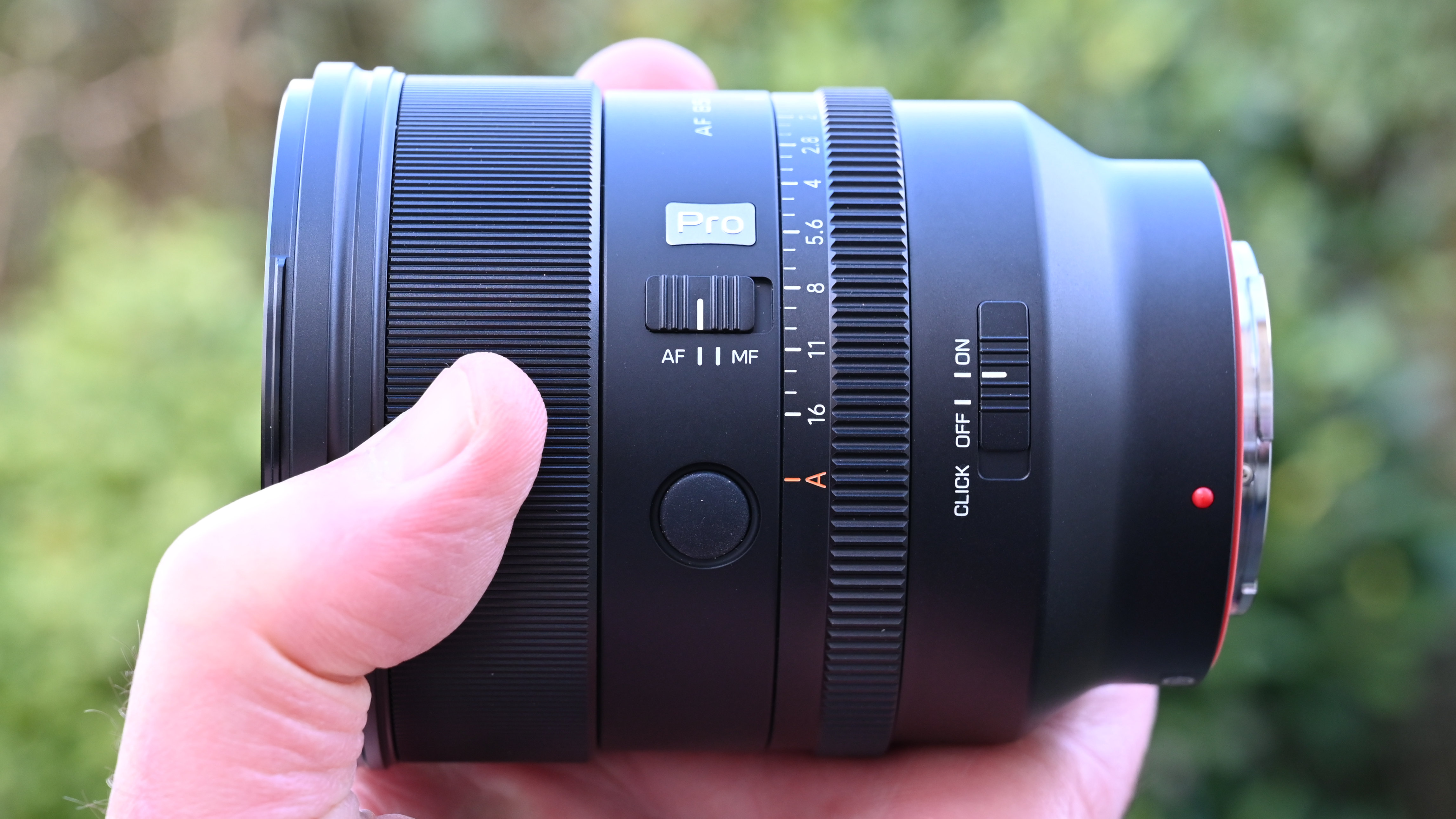 Viltrox AF 85mm f/1.4 Pro product shot, lens in hand