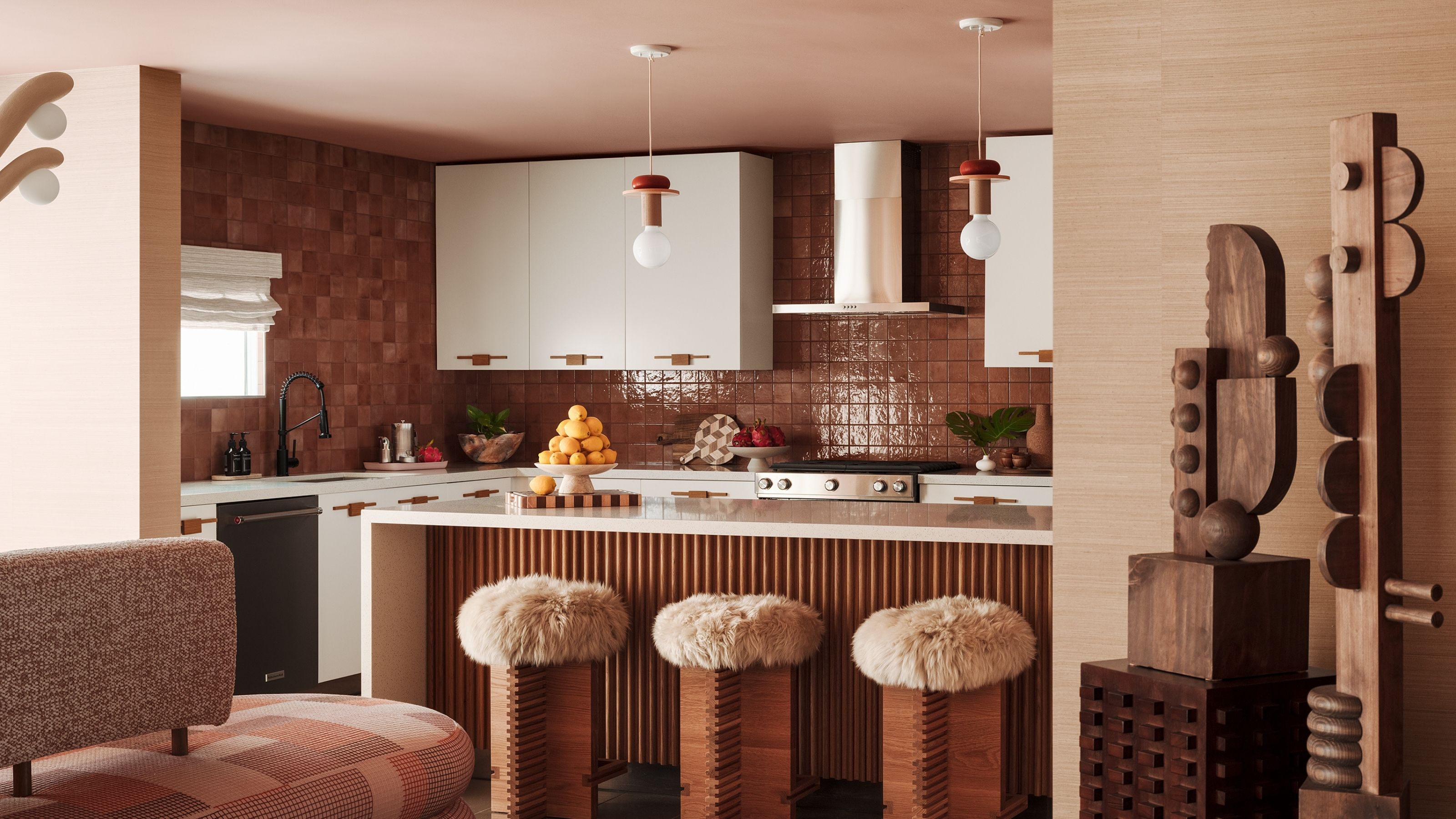 Tiled, beige-tinted kitchen with Island and fuzzy bar stools
