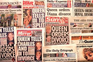 Copies of the Sun newspaper covering Charles and Diana's divorce on the front pages