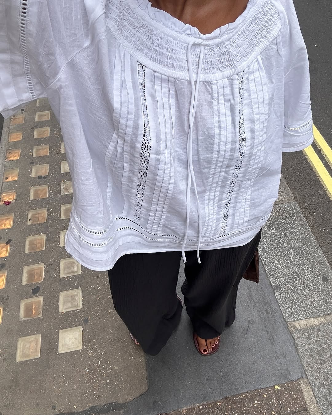woman wearing white linen top