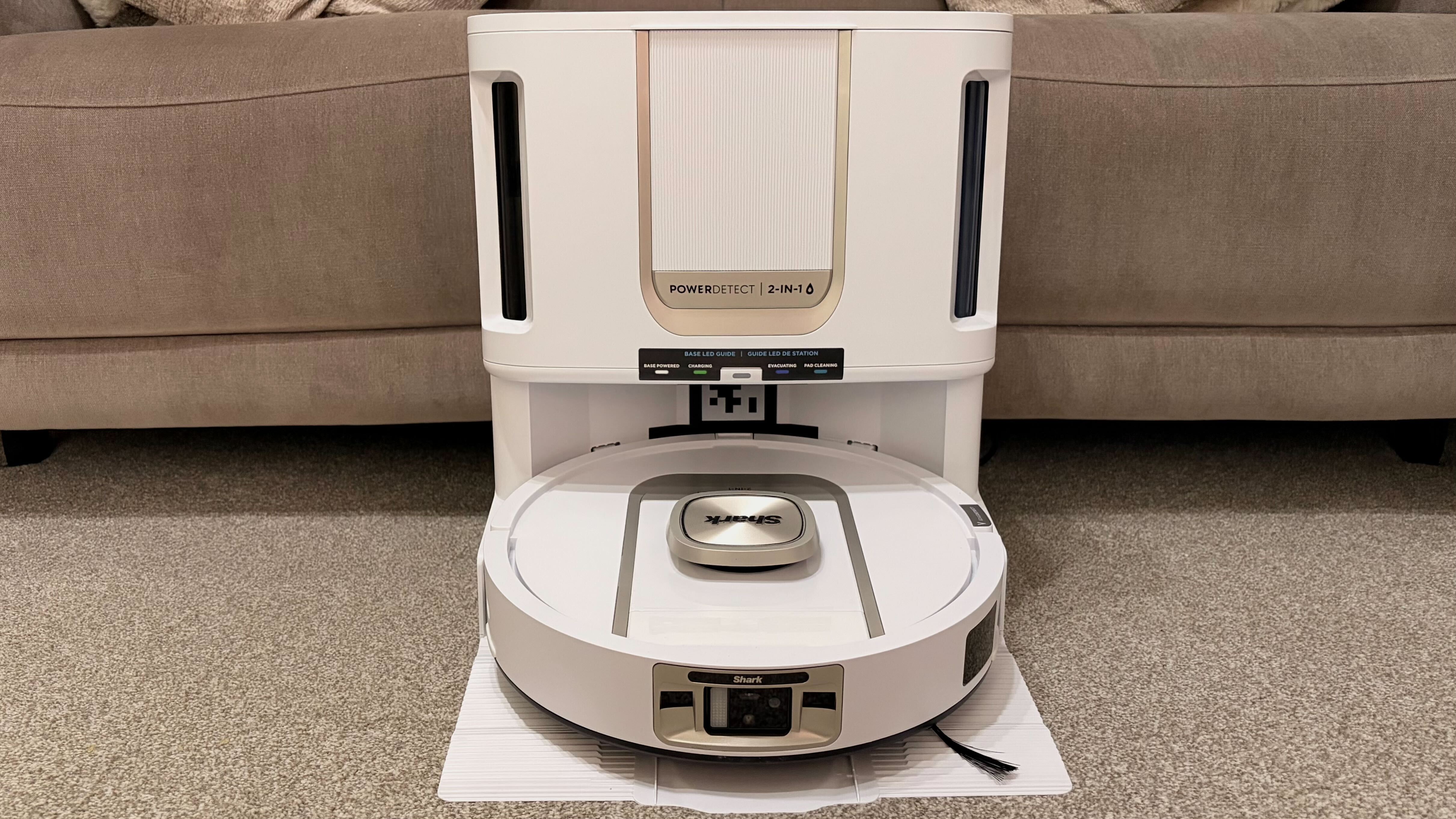 Shark PowerDetect 2-in-1 ThermaCharged NeverTouch photographed on a carpet with docking station