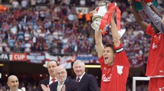 CARDIFF, ENGLAND - MAY 13: (NO PUBLICATION IN UK MEDIA FOR 28 DAYS) Liverpool captain Steven Gerrard raises the FA Cup trophy after the final between Liverpool and West Ham United at the Cardiff Millenium Stadium on May 13, 2006 in Cardiff, England. (Photo by Pool - Anwar Hussein Collection/Getty Images)