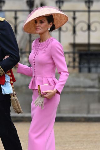 Queen Letizia wearing a bubblegum pink co ord and hat