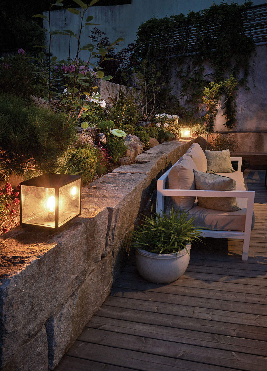 cube garden lights on stone wall on deck