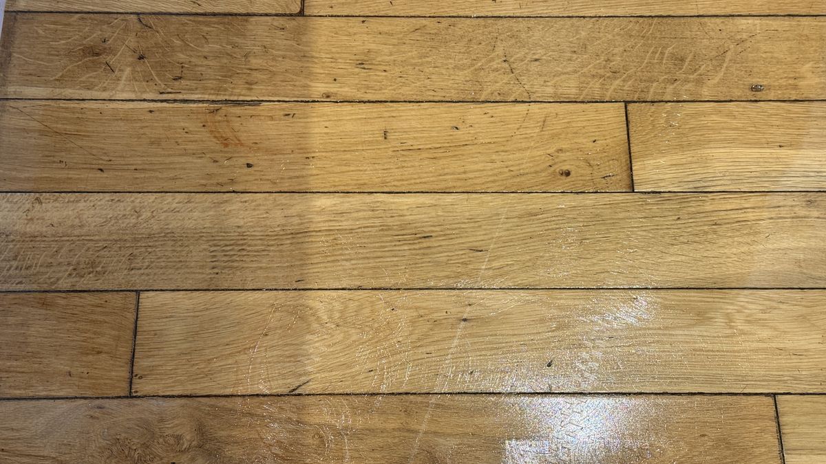 Roborock Qrevo Curv 2 Pro cleaning a spillage from a hard floor