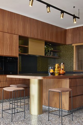 A mid-century kitchen with metallic accents