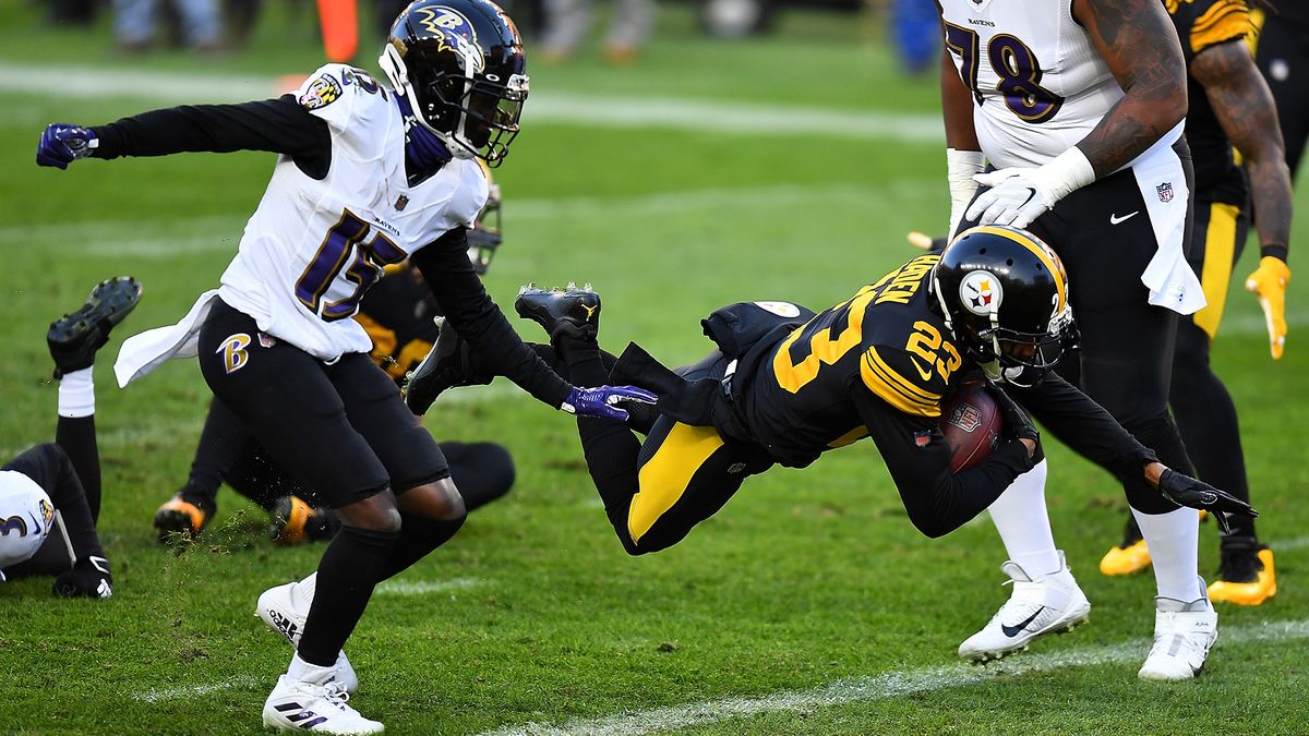 Joe Haden #23 of the Pittsburgh Steelers carries the ball for a touchdown after intercepting a pass during the first quarter against the Baltimore Ravens at Heinz Field on Dec. 1, 2020 in Pittsburgh, Pennsylvania.