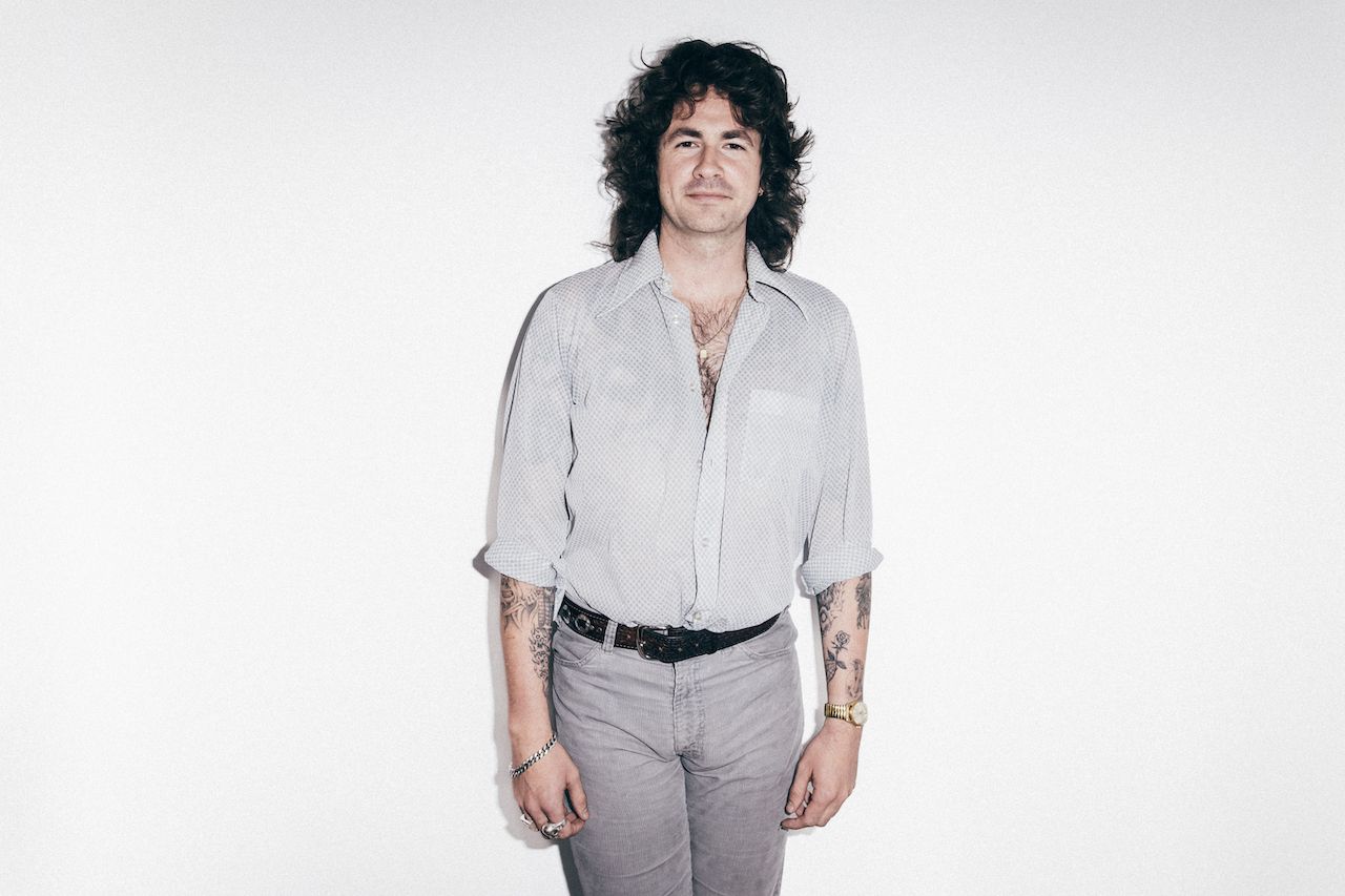Portraits of Amyl And The Sniffers band members against a white background