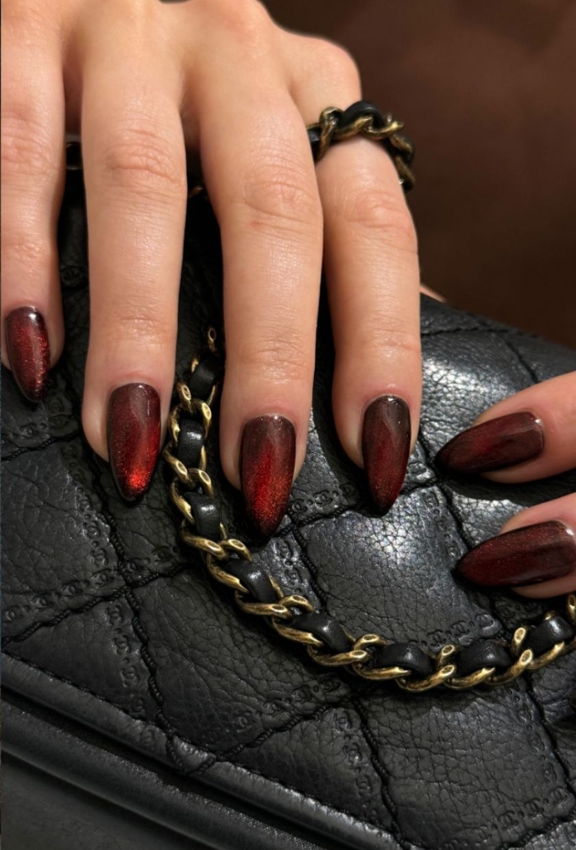 a close-up shot of burgundy velvet nails