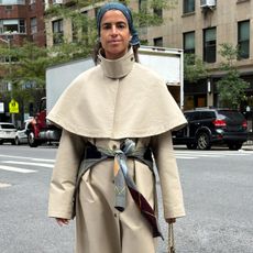 Influencer wearing beige Zara cape trench coat