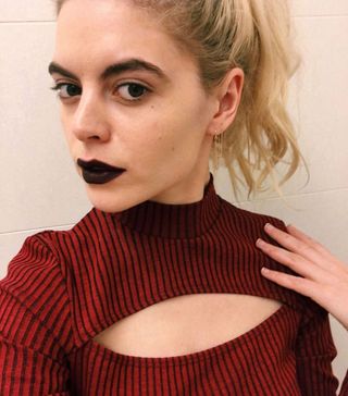 blonde person wearing black lipstick