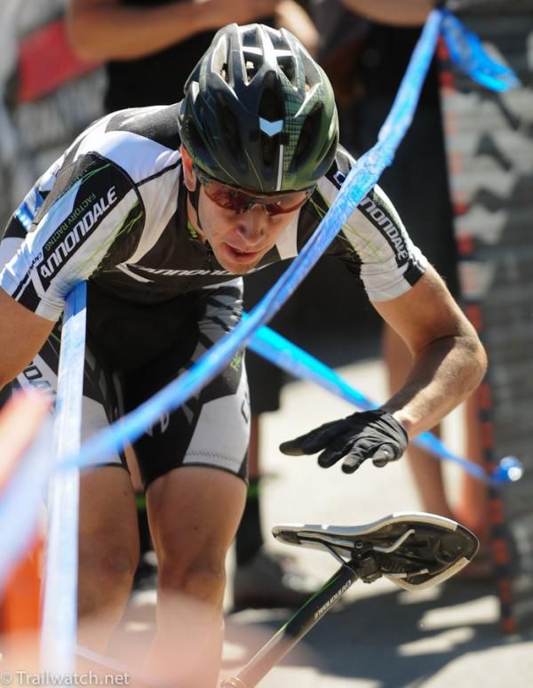 Jeremiah Bishop (Cannondale) trying to collect his bike after crashing in a corner