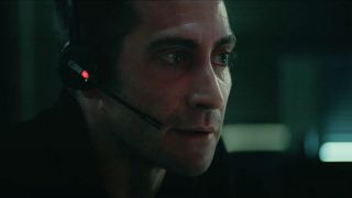 Jake Gyllenhaal intensely listening to a 911 call in The Guilty.