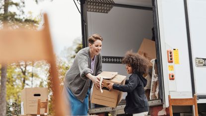 Removal van being loaded with boxes