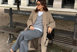 woman in camel coat and gray outfit