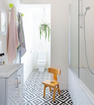 White bathroom with black and white floor tiles