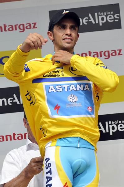 Race leader Alberto Contador gets some assistance with his yellow jersey.