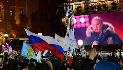 Vladimir Putin addresses supporters after landslide presidential election victory