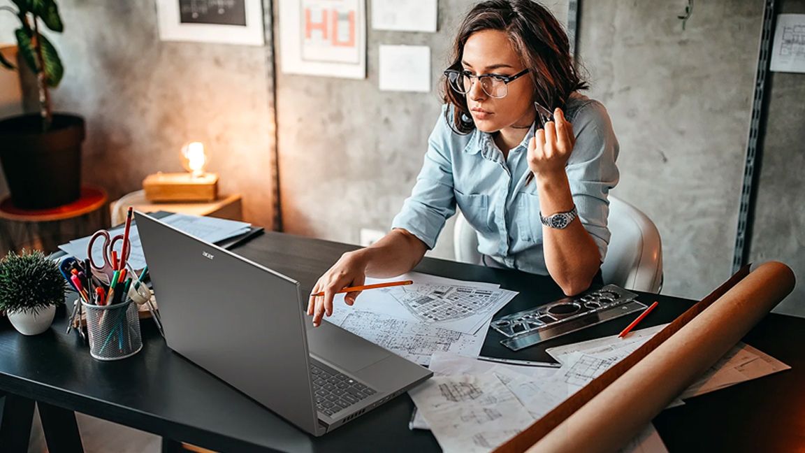 Acer Swift X 16; a woman uses a laptop