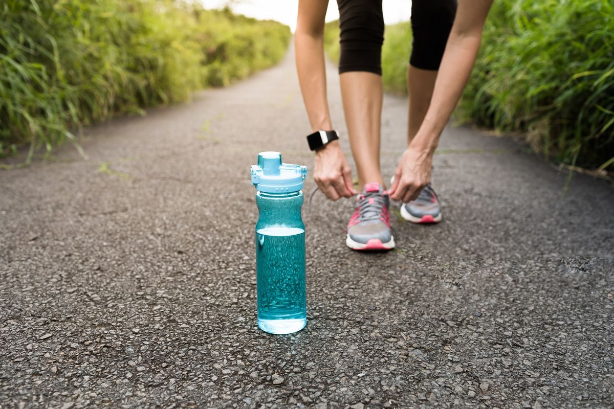 Nuun Sport Electrolyte Drink Tablets deal: Image shows woman exercising with a bottle of water