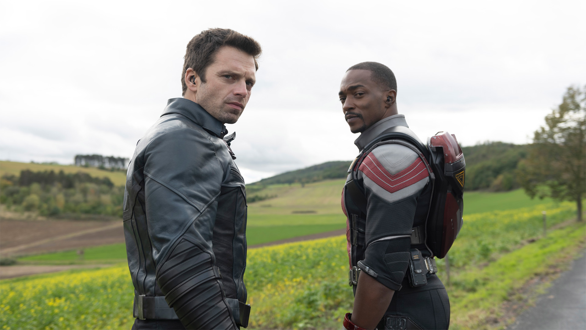 Sam and Bucky stare back at something off-camera in The Falcon and the Winter Soldier episode 2