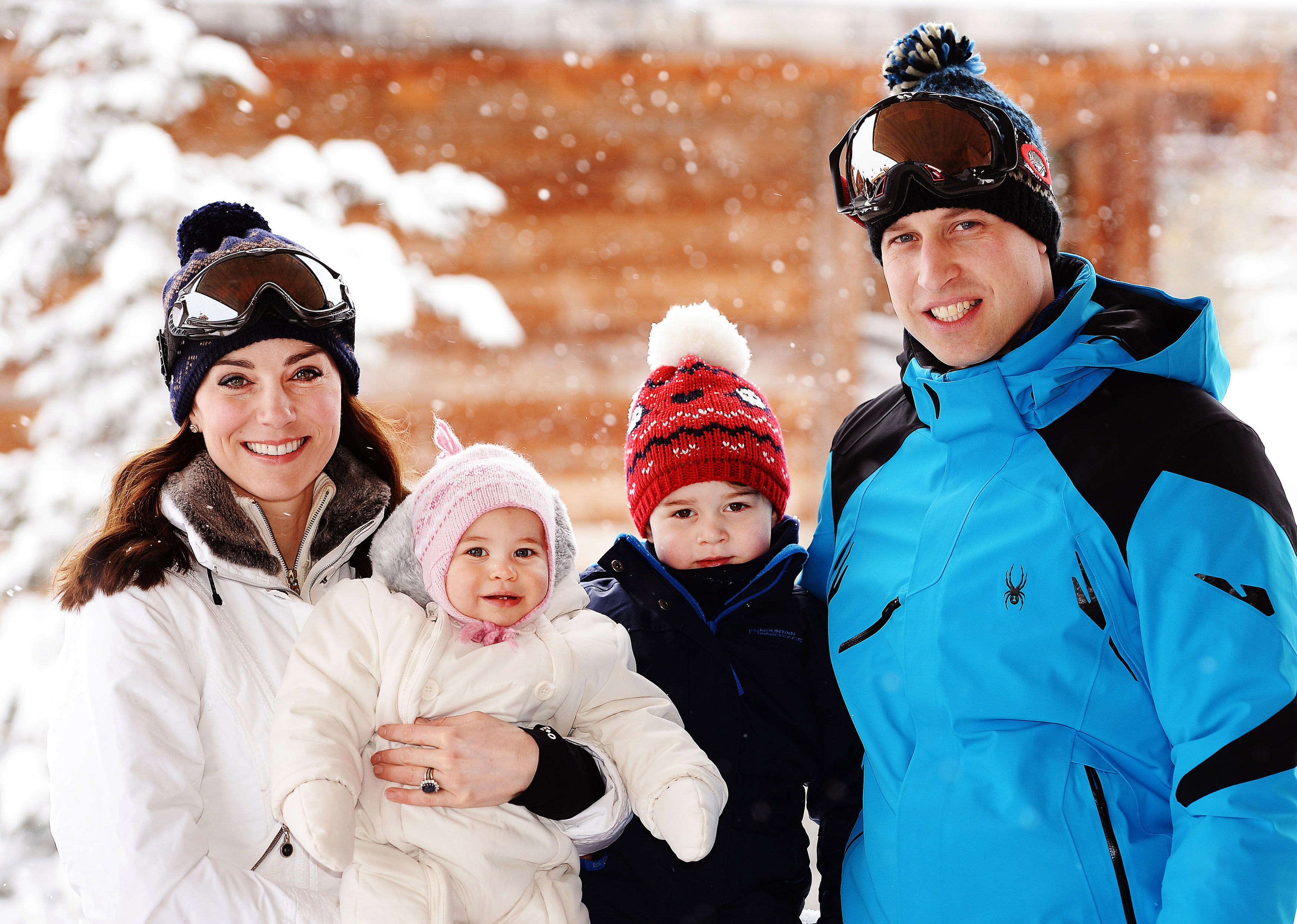 Prince William, Princess kate, Princess Charlotte and Prince George wearing ski outfits in the snow