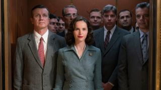 Felicity Jones as Ruth Bader Ginsberg in On The Basis of Sex in an elevator full of men