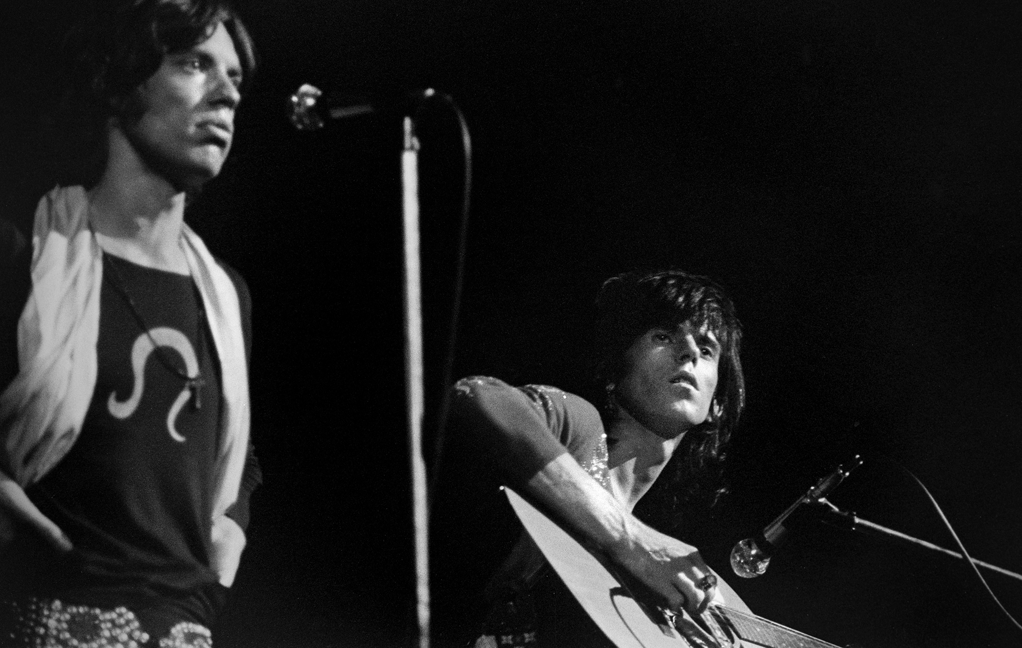 The Rolling Stones perform at the Boston Garden. Keith Richards plays the acoustic guitar as Mick Jagger sings, U.S. tour winter 1969