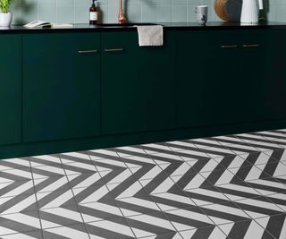 modern green kitchen with black and white zigzag floor tiles