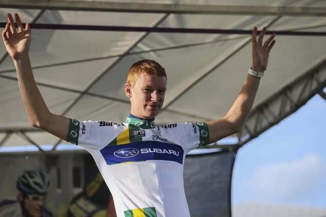 Jack Haig pulls on the NRS leader's jersey after victory at Battle on the Border