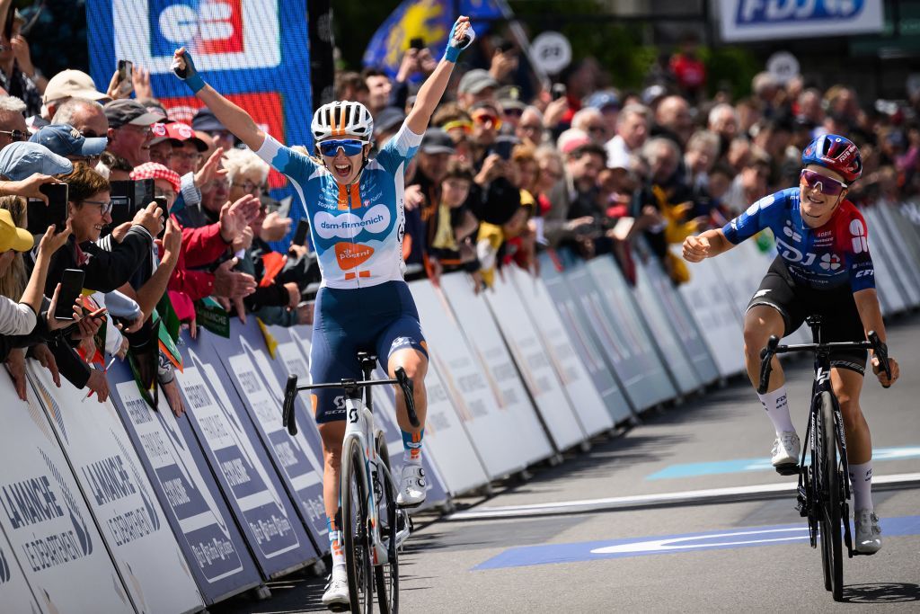 French dsm-firmenich PostNL team&#039;s cyclist Juliette Labous (L) celebrates while crossing the finish line ahead of FDJ-Suez team Gladys Verhulst Wild (R), to win the Elite road women French championships cycling race, in Saint-Martin-de-Landelles, western France, on June 22, 2024. (Photo by LOIC VENANCE / AFP)