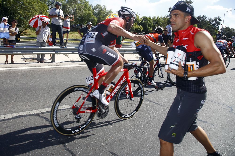 A Trek-Segafredo riders grabs a bottle