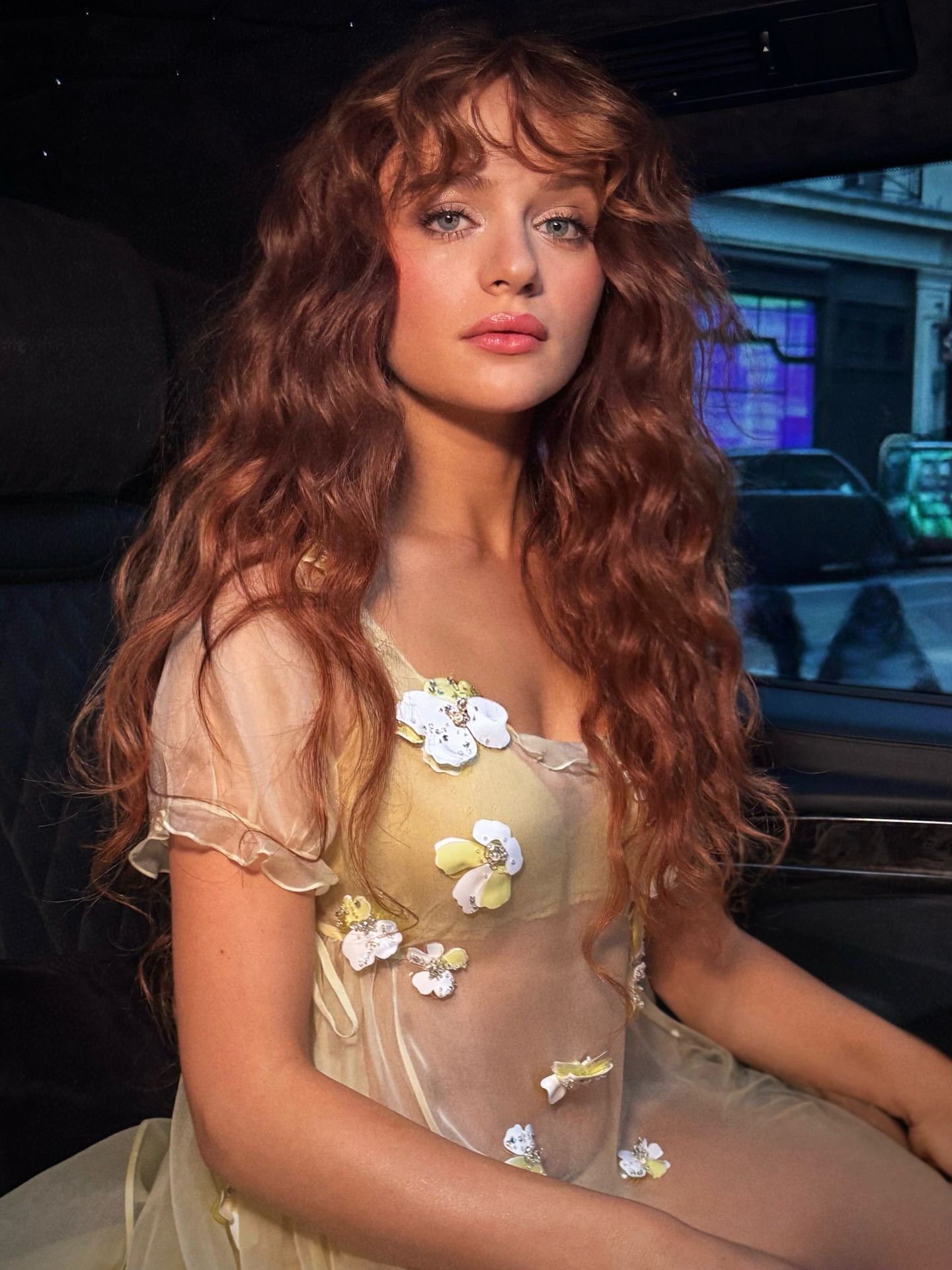 Joey King with long layered curly hair