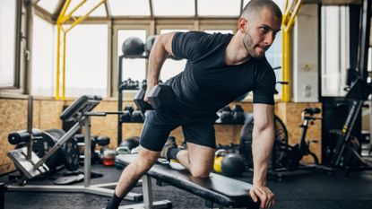 Man performing bent-over dumbbell rows