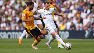Wolves and Leeds players fight for the ball