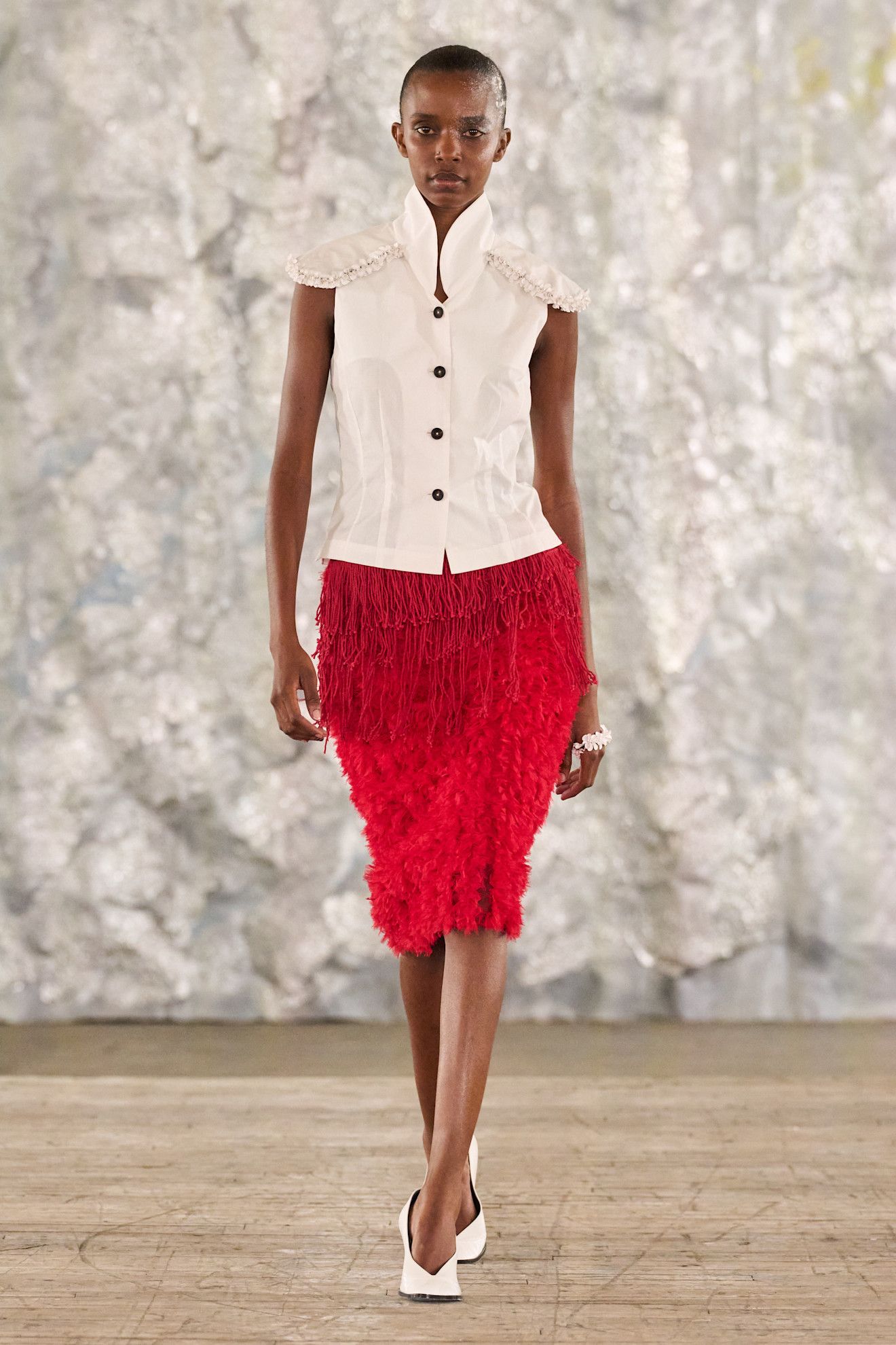 A red skirt on the Diotima runway