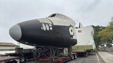 closeup photo of the black and white nose of a space shuttle mockup 