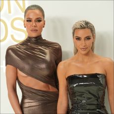 Khloe Kardashian and Kim Kardashian glammed up at the 2022 CFDA Fashion Awards.
