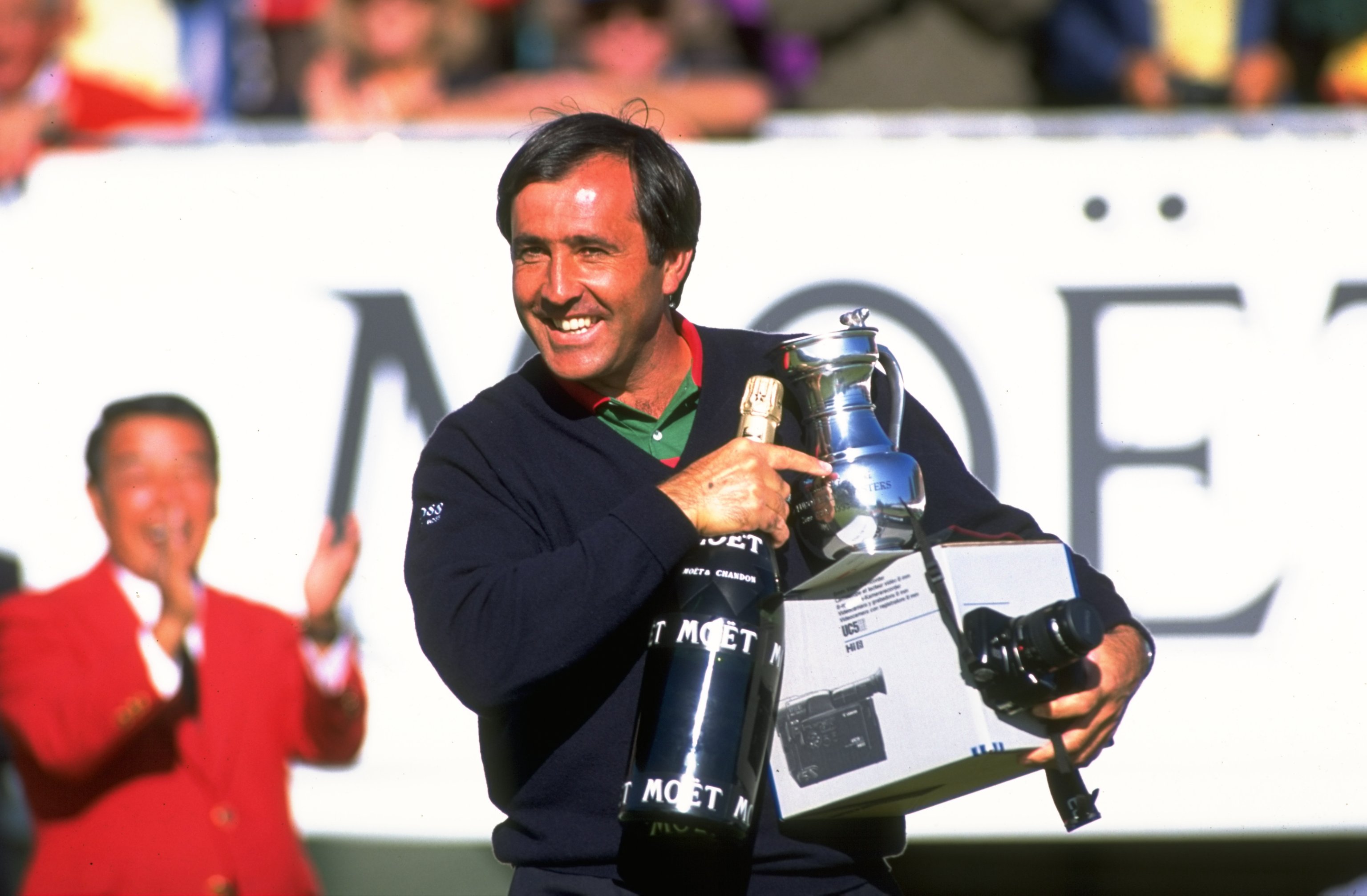 Seve Ballesteros holds the Omega European Masters trophy and a bottle of champagne