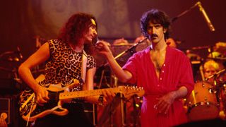 Steve Vai (left), on guitar, and Frank Zappa (1940 - 1993) perform on stage at the Palladium, New York, New York, October 31, 1981
