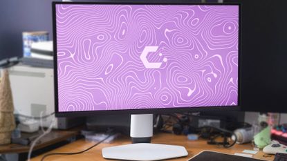 BenQ Mobiuz EX271UZ monitor on desk with purple CatchyOS wallpaper on screen.