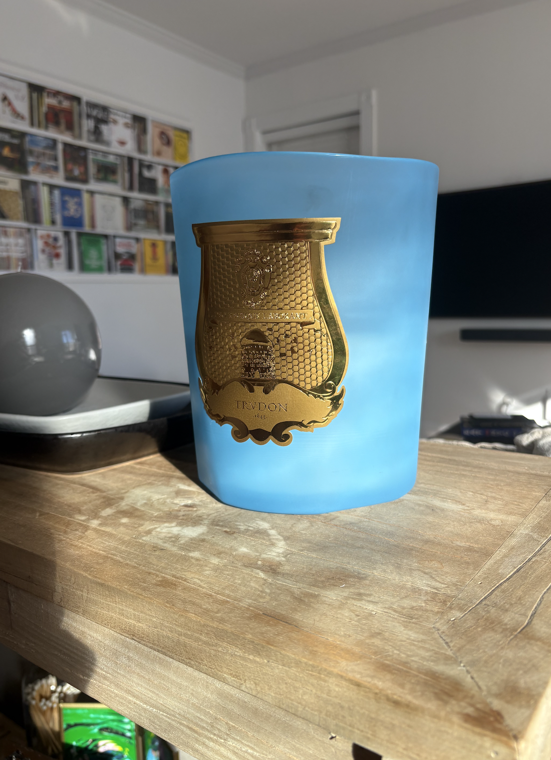 candle on a wooden table