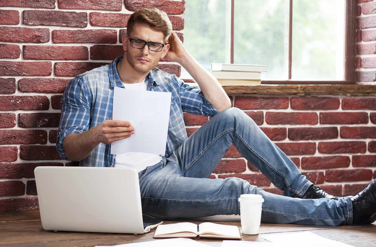 Man examining documents.